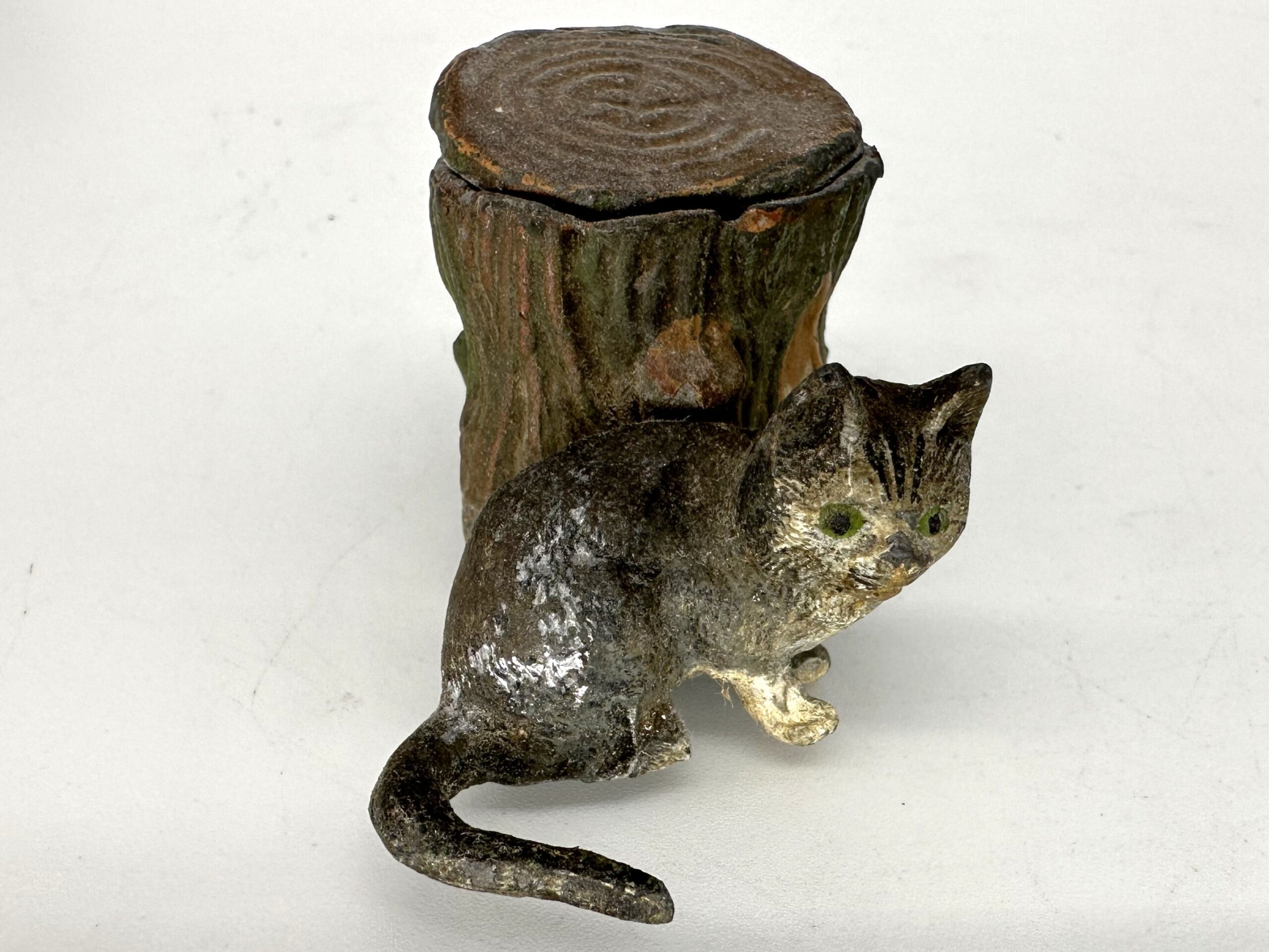Cat Crouching Next to Stump