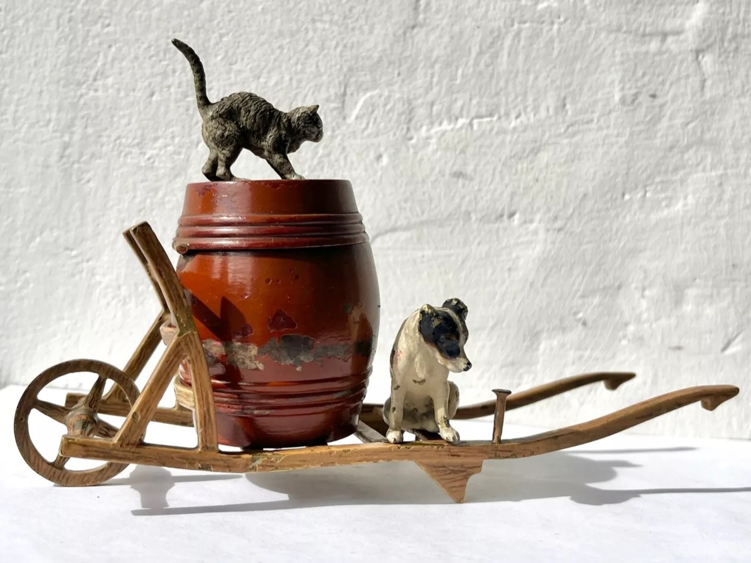 Dog and Cat on a Wheelbarrow