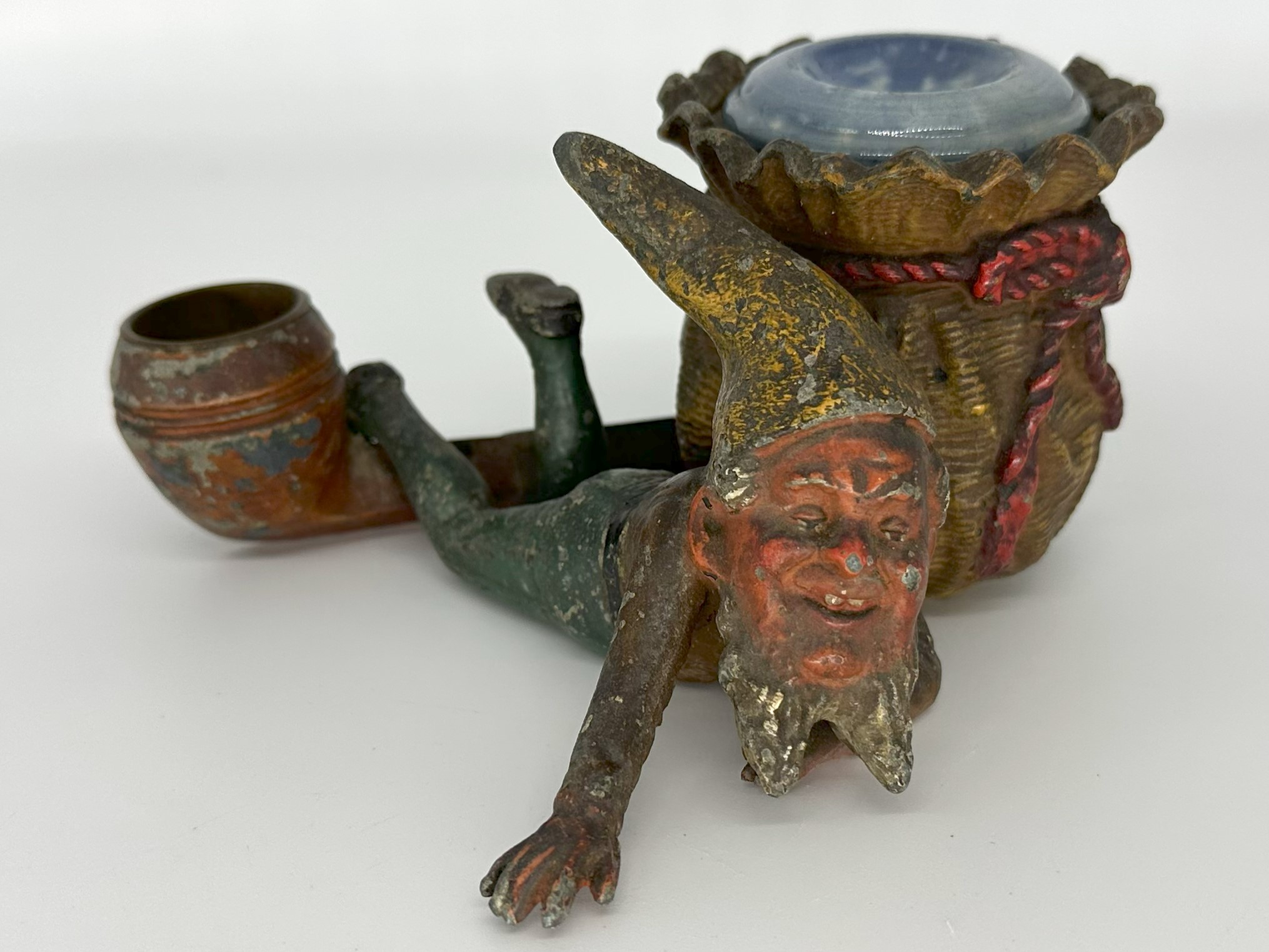 Dwarf Lying Next to a Sack and Pipe