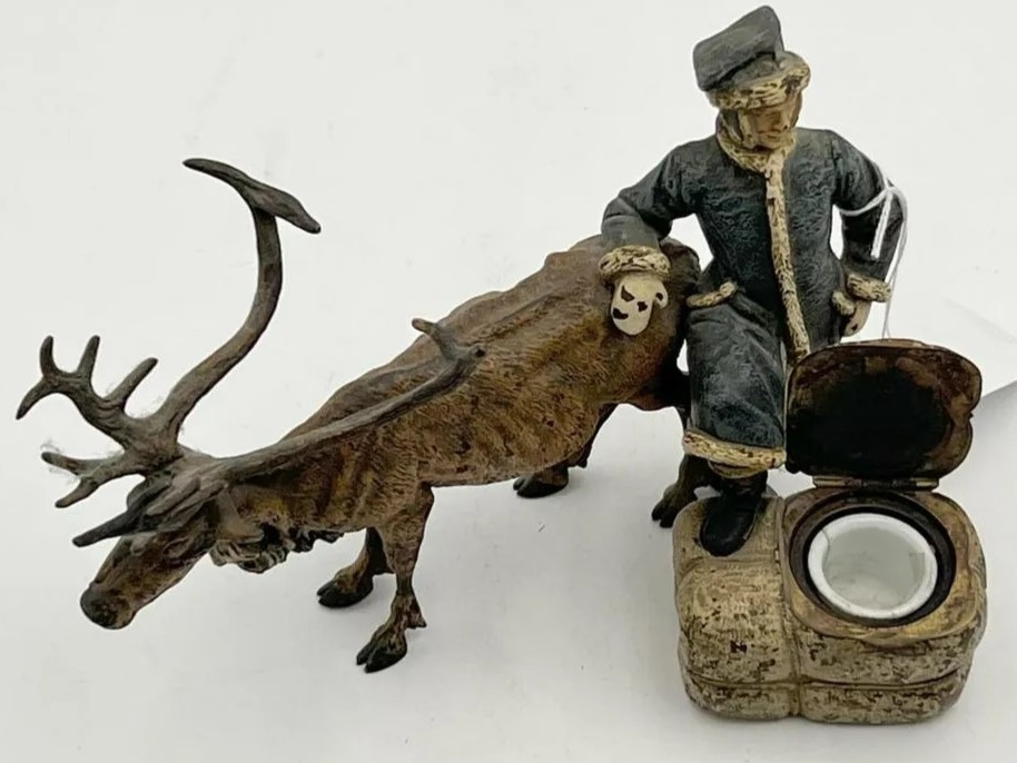 Bronze Caribou and Handler