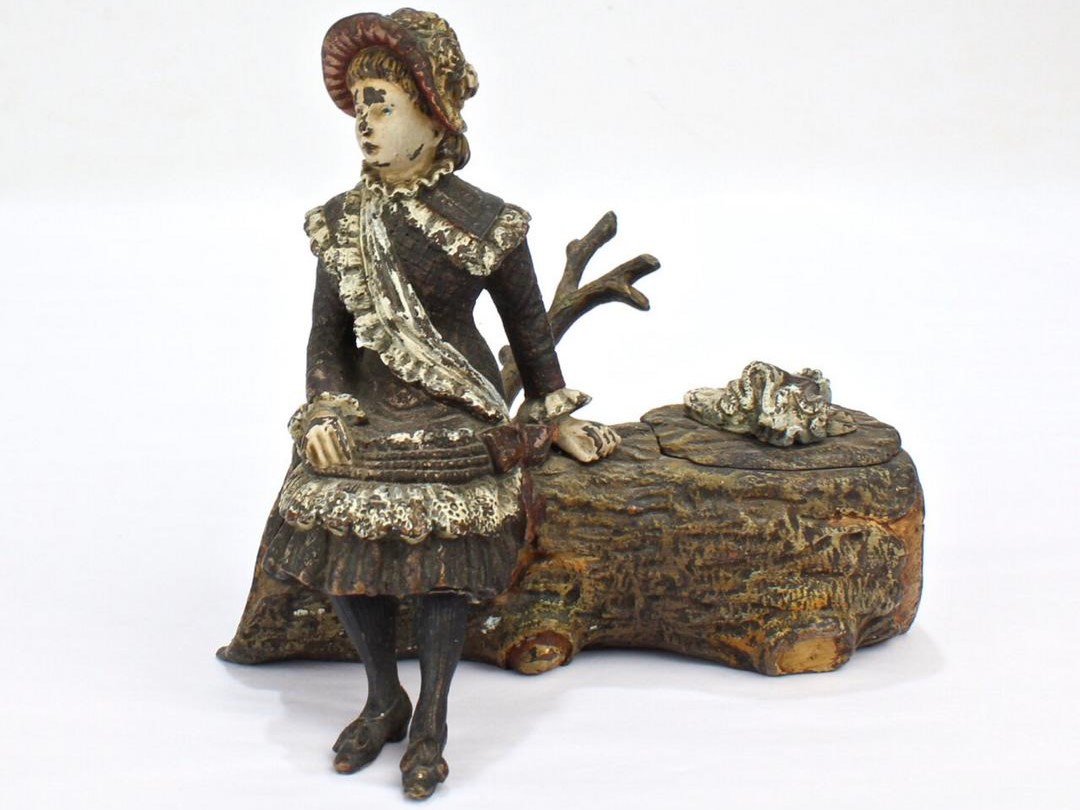 Young Woman Sitting on a Log
