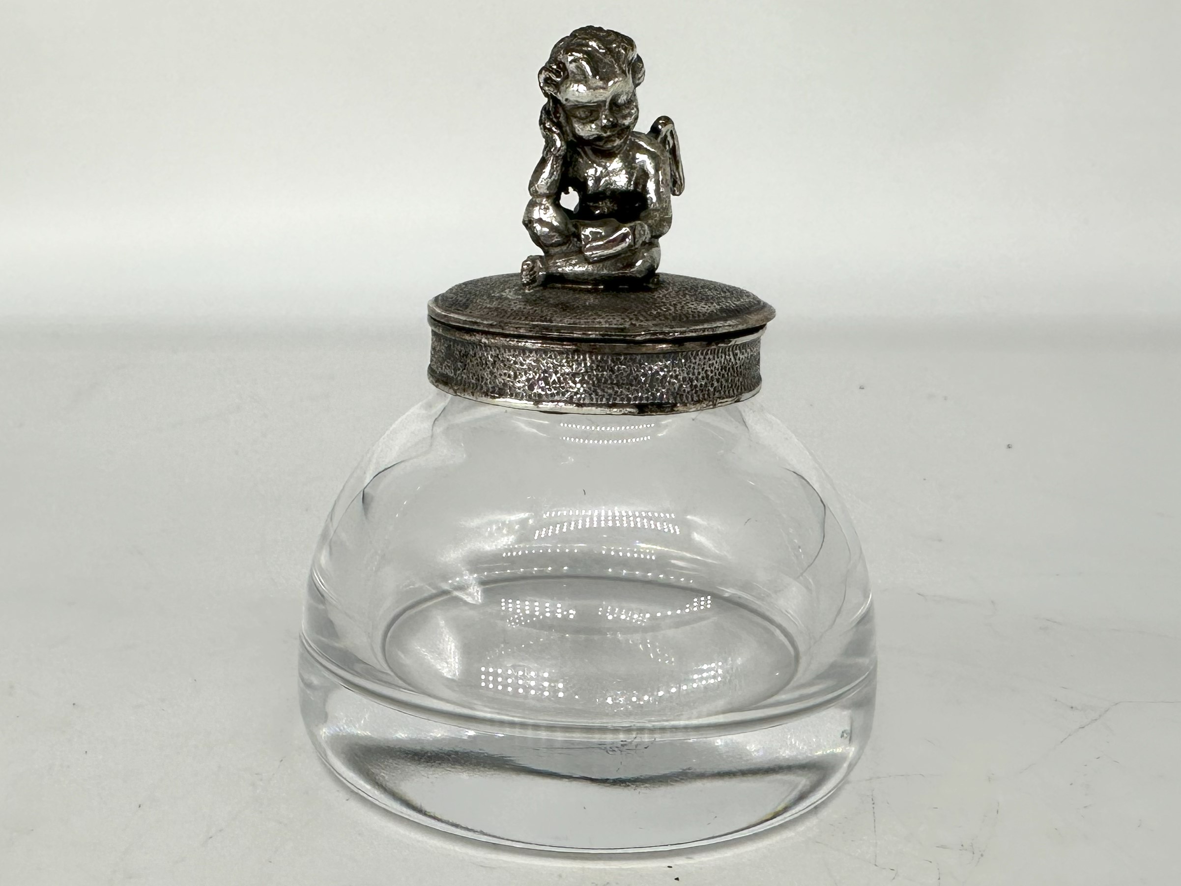 Cupid Sits on an Inkwell