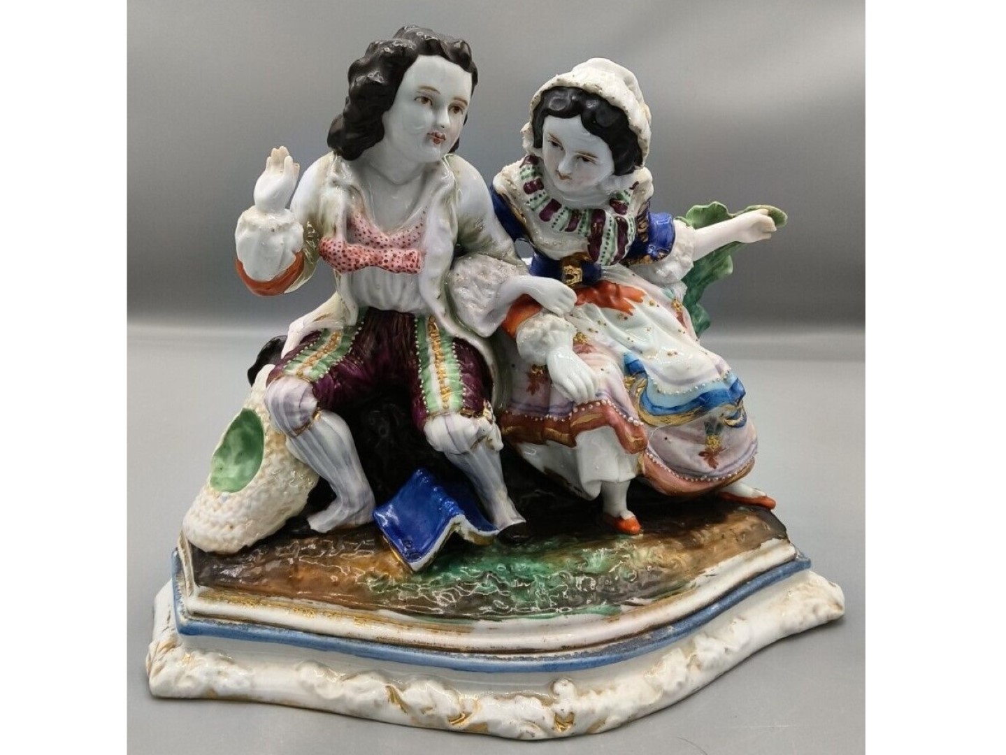 Boy and Girl Sitting on a Bench