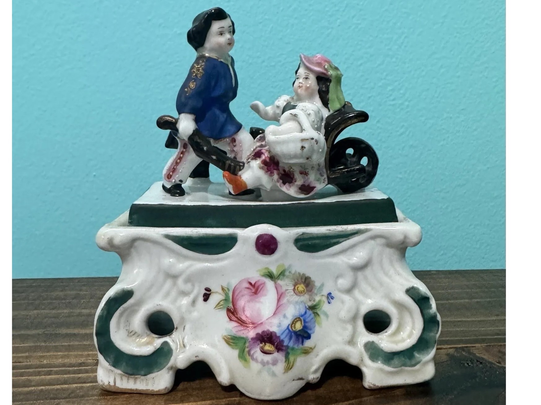 Boy with Girl in Wheelbarrow