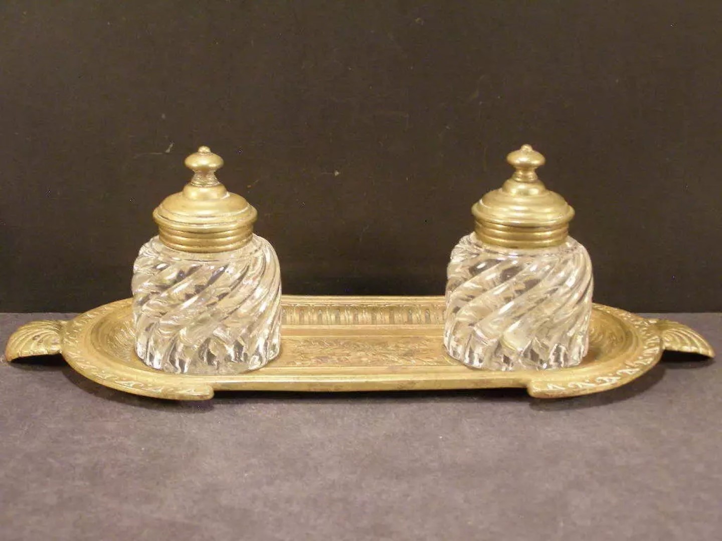 Two Swirl Glass Inkwells on a Bronze Tray