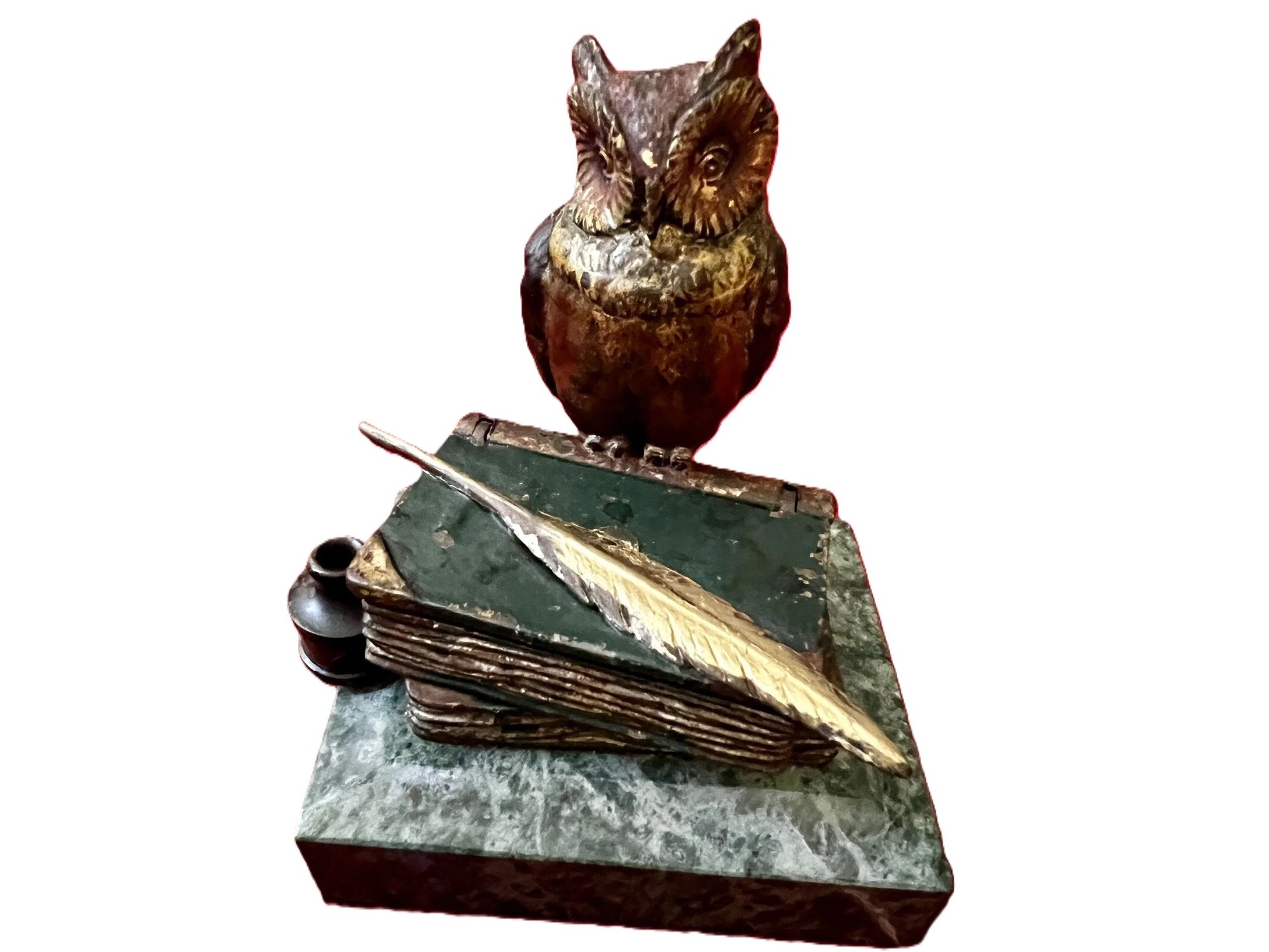Bronze Owl Perched atop Books