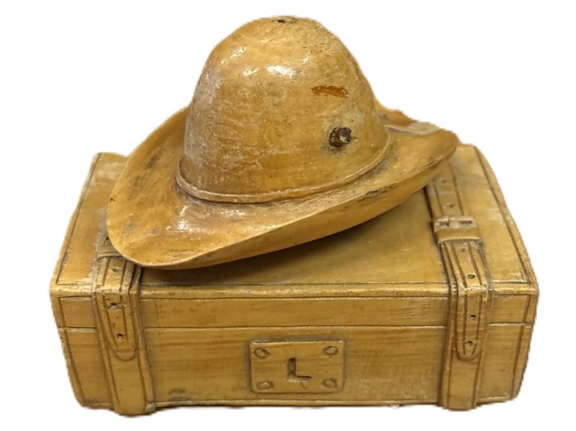 Hand-Carved Hat on a Trunk